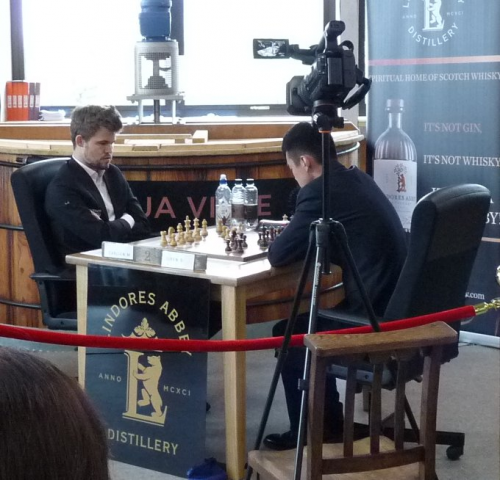 Carlsen and Ding playing